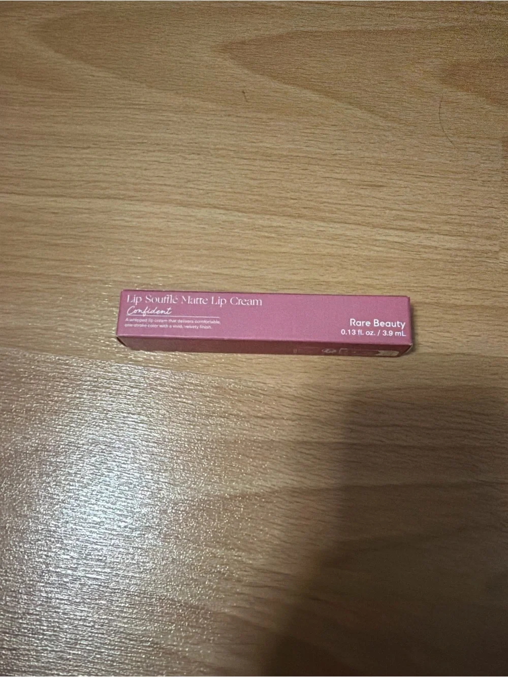 Lip product on wooden surface